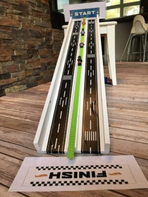 The is the easiest DIY toy car ramp ever! This homemade car ramp will keep your little ones entertained for hours! DIY hot wheels track for toy car racing! #diy #diyramp #diykids #easydiy #toycarramp #kidsracetrack #toycarracing #carrampsfortoddlers #toddlerracetrack 